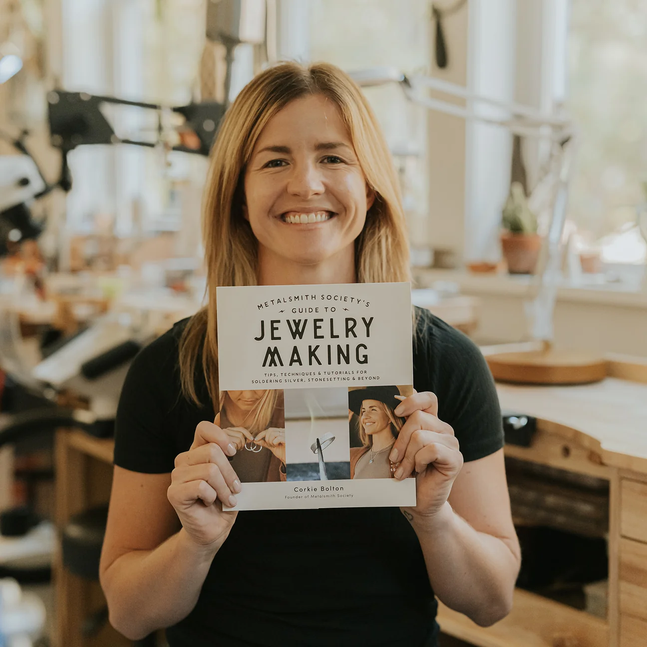 Corkie Bolton holding Metalsmith Society's Guide to Jewelry Making